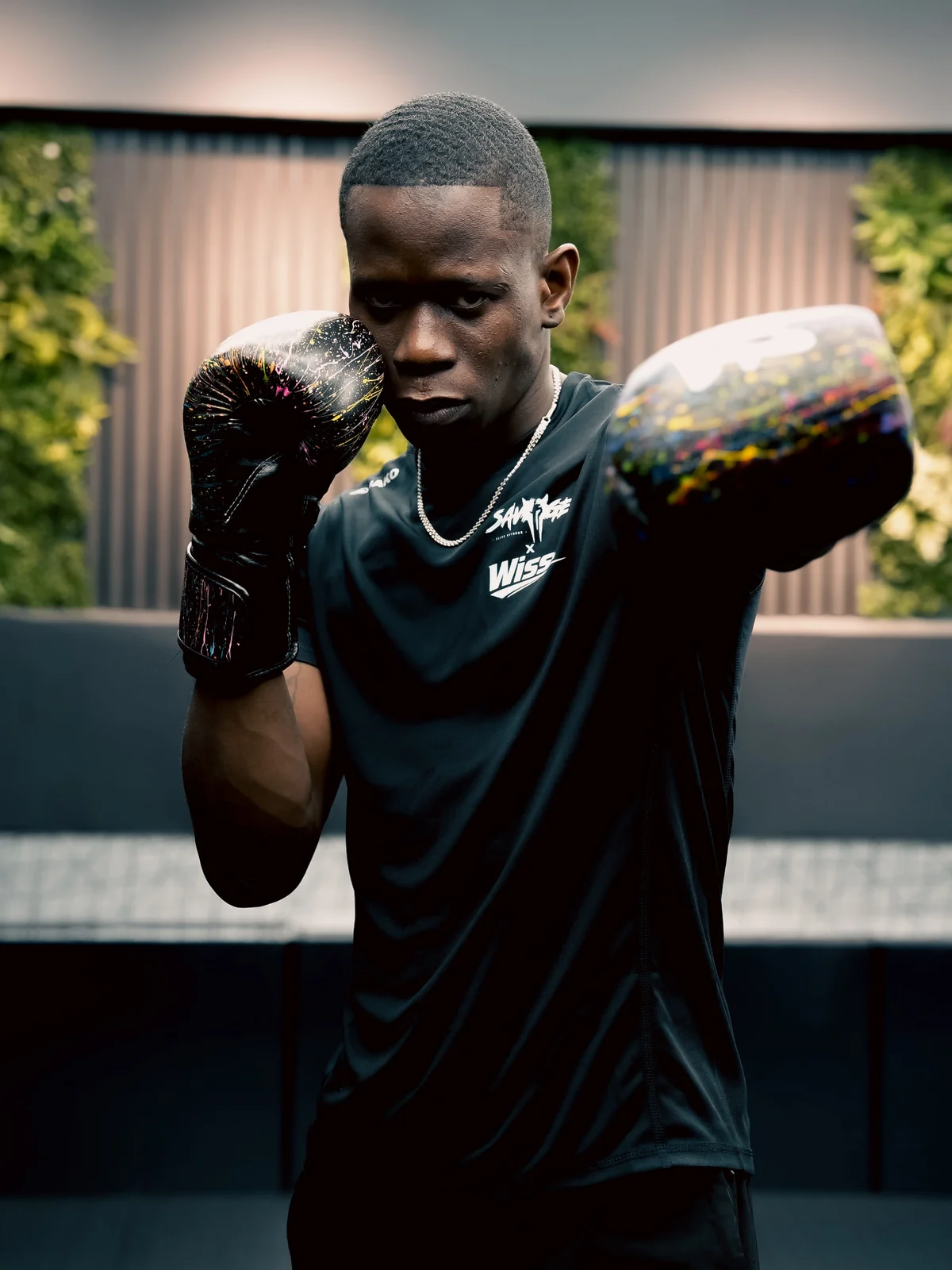 Savage boxer throwing a punch toward the camera in the boxing area